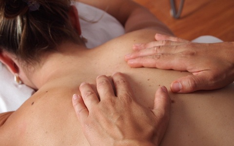 lady enjoying a relaxing back massage